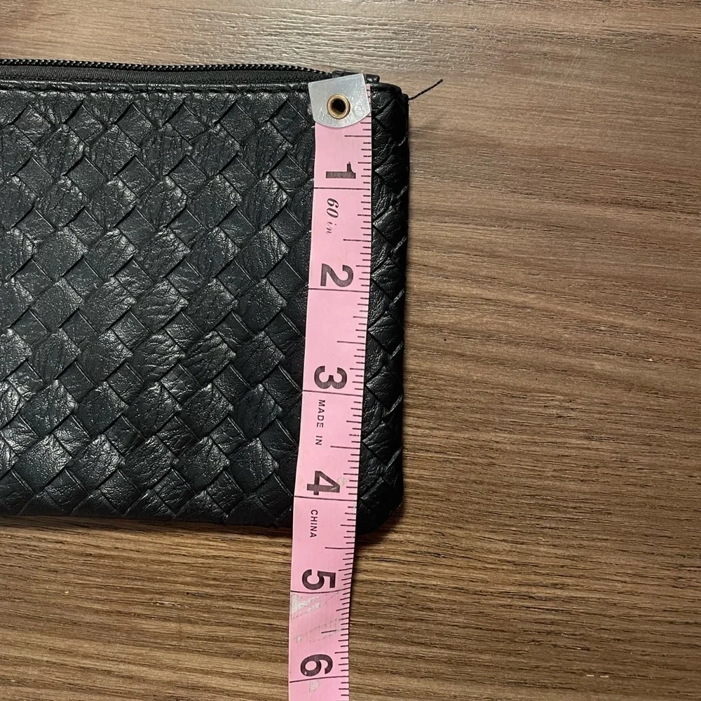 Small Black Pattern Wristlet With Zipper & Metal Clasp Closure.